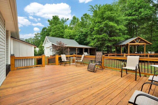 1010 Bradford Pl, Cohutta, GA 30710 - wooden terrace with a gazebo, an outbuilding, and view of scattered trees