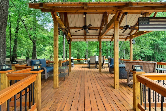 1010 Bradford Pl, Cohutta, GA 30710 - wooden terrace with ceiling fan, outdoor dining space, and outdoor lounge area