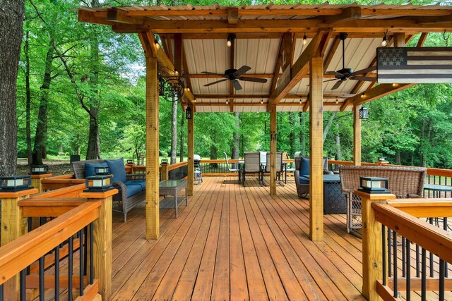 1010 Bradford Pl, Cohutta, GA 30710 - wooden terrace with ceiling fan, outdoor dining space, and outdoor lounge area