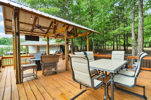 1010 Bradford Pl, Cohutta, GA 30710 - deck with ceiling fan, outdoor dining area, and view of scattered trees