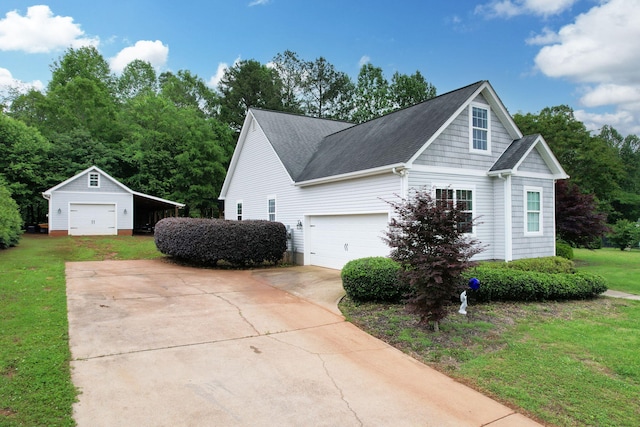 1010 Bradford Pl, Cohutta, GA 30710 - view of side of home with driveway, a lawn, a garage, and an outdoor structure
