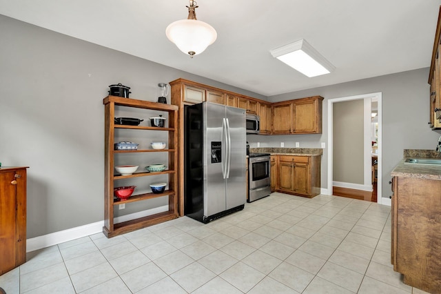 1010 Bradford Pl, Cohutta, GA 30710 - kitchen with appliances with stainless steel finishes, a sink, brown cabinetry, and baseboards