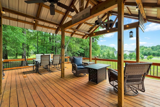 1010 Bradford Pl, Cohutta, GA 30710 - wooden terrace with ceiling fan, outdoor dining space, view of scattered trees, and a gazebo