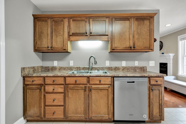 1010 Bradford Pl, Cohutta, GA 30710 - kitchen with stainless steel dishwasher, a sink, brown cabinets, and recessed lighting