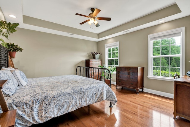 1010 Bradford Pl, Cohutta, GA 30710 - bedroom featuring light wood-type flooring, a raised ceiling, baseboards, recessed lighting, and a ceiling fan