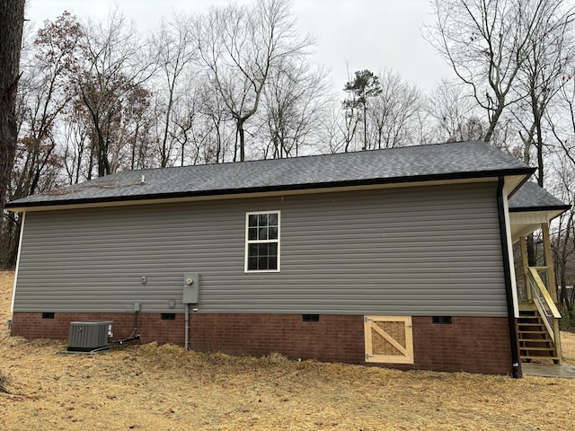 view of side of home featuring central air condition unit