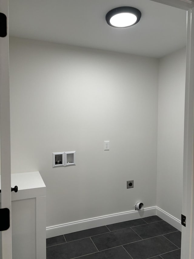 laundry area featuring hookup for an electric dryer, washer hookup, and dark tile patterned floors