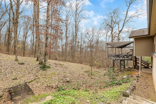 view of yard featuring a wooden deck