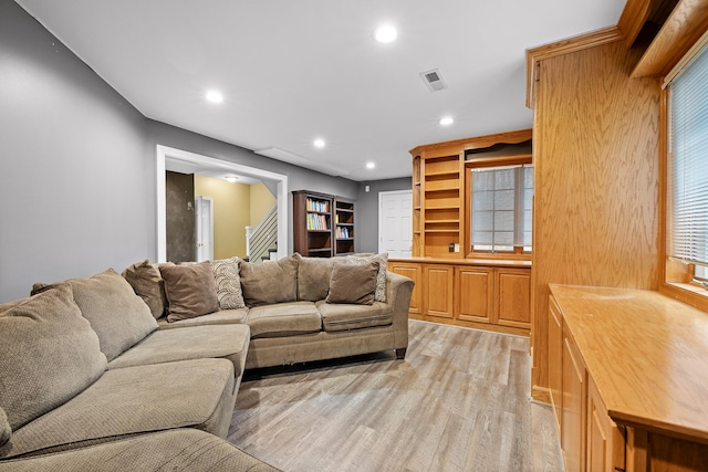 living room with light hardwood / wood-style floors