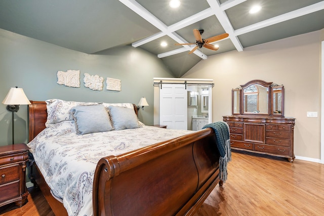 bedroom with beam ceiling, ensuite bath, ceiling fan, coffered ceiling, and light wood-type flooring