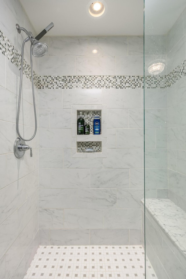 bathroom with tiled shower