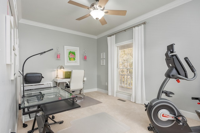 home office with light carpet, ceiling fan, and ornamental molding