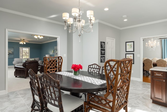 dining room with light carpet, ceiling fan with notable chandelier, and ornamental molding