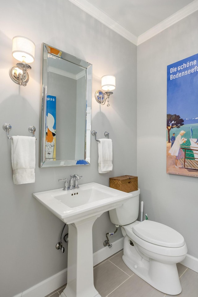 bathroom with toilet, tile patterned floors, and crown molding