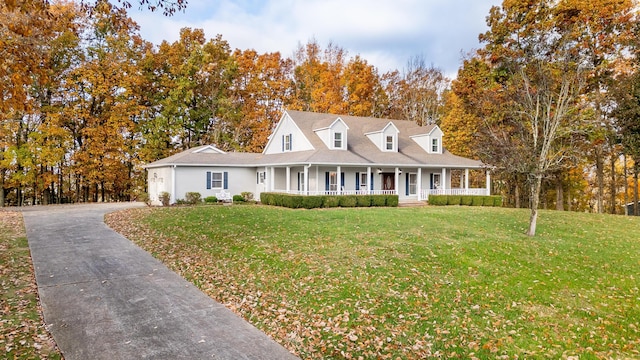 view of front of home featuring a front yard and a porch