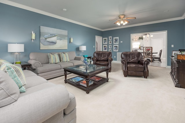 carpeted living room featuring ceiling fan and crown molding