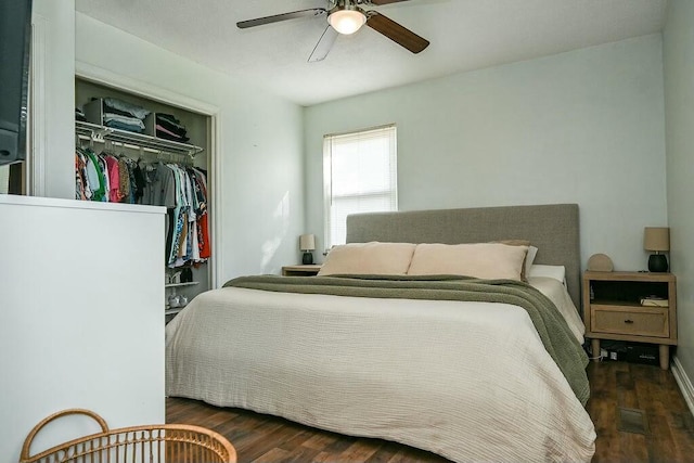 bedroom with a closet, visible vents, ceiling fan, and wood finished floors