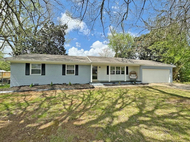 ranch-style home featuring brick siding, a front yard, driveway, and a garage