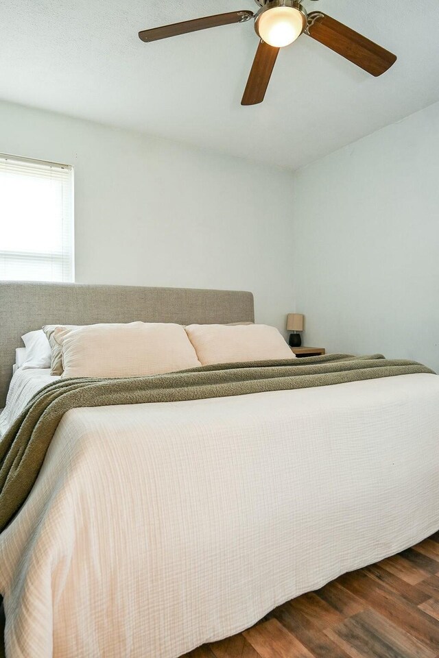 bedroom featuring ceiling fan and wood finished floors