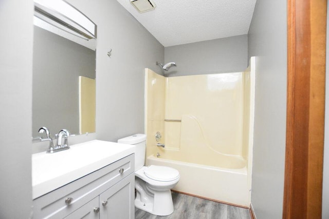 3800 Provence St Unit 10, Chattanooga, TN 37411 - full bathroom with wood finished floors, toilet, vanity, a textured ceiling, and bathtub / shower combination
