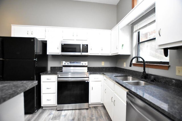 3800 Provence St Unit 10, Chattanooga, TN 37411 - kitchen with stainless steel appliances, a sink, white cabinets, and wood finished floors