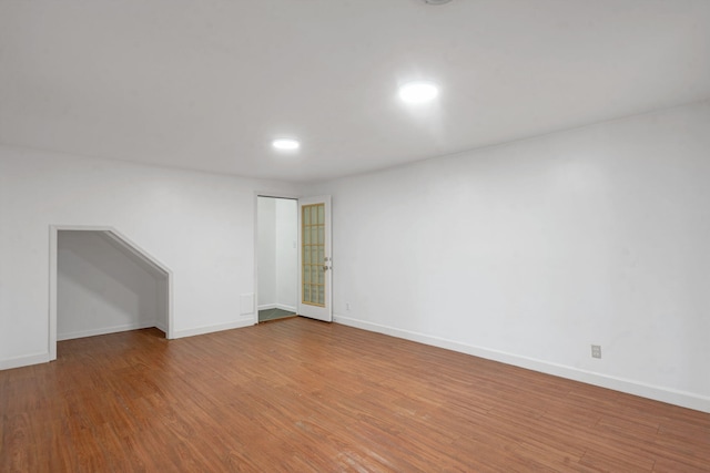 unfurnished room with hardwood / wood-style flooring