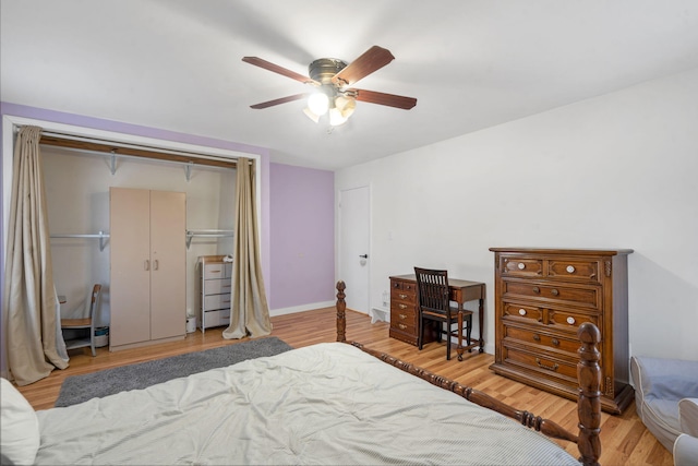 bedroom with ceiling fan, a closet, and light hardwood / wood-style floors