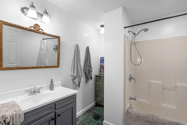 bathroom featuring tub / shower combination and vanity