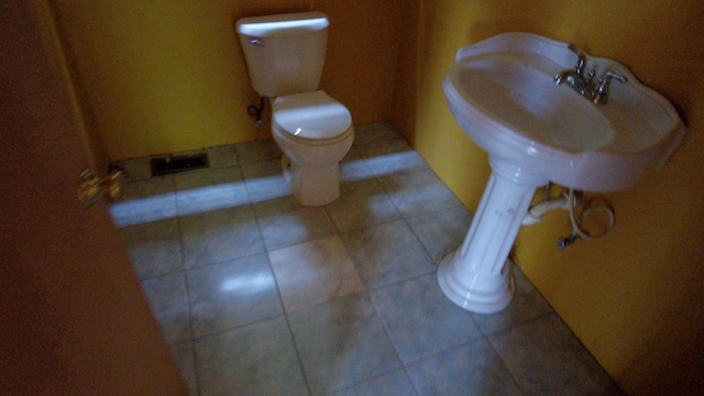 bathroom featuring tile patterned floors and toilet