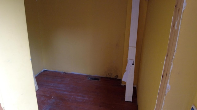 hallway featuring dark wood-type flooring