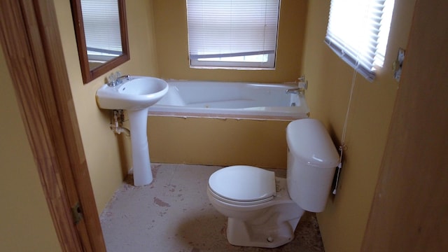 bathroom with a bath, toilet, and sink