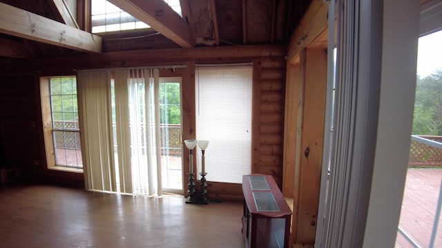 entryway featuring rustic walls