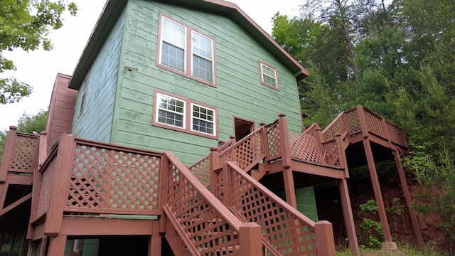 rear view of house featuring a deck