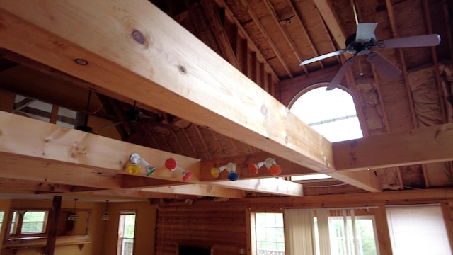 interior details featuring ceiling fan and beamed ceiling