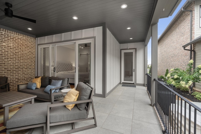 balcony with ceiling fan and an outdoor living space