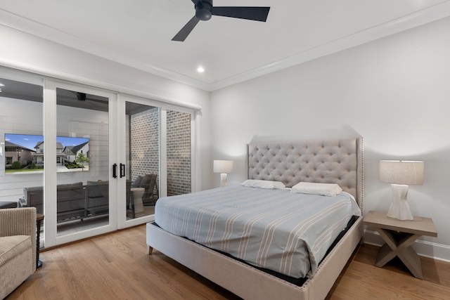 bedroom featuring access to exterior, wood-type flooring, ceiling fan, and crown molding