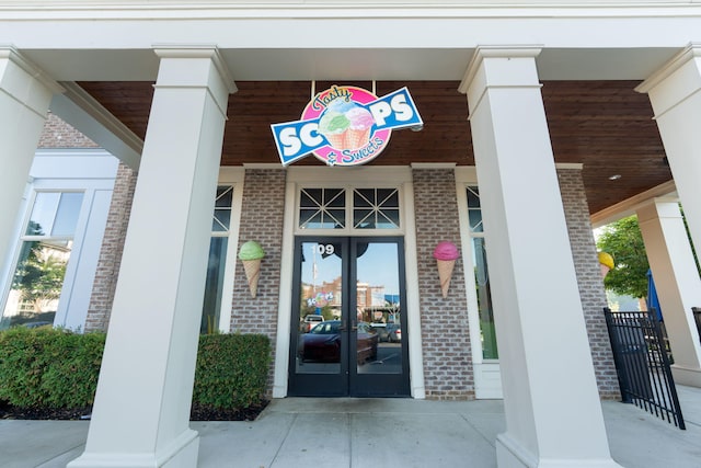 view of exterior entry featuring french doors