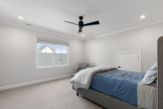 bedroom featuring carpet flooring, ceiling fan, and crown molding