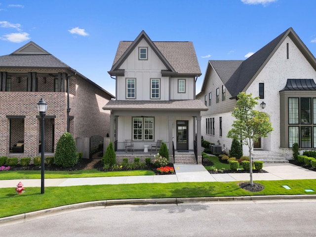 view of front facade with covered porch and a front lawn