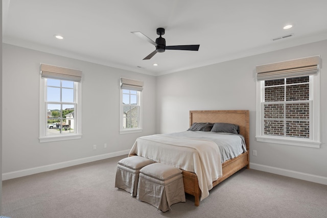 bedroom featuring ceiling fan, carpet floors, and ornamental molding