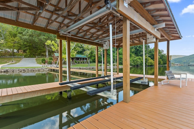 view of dock with a water and mountain view