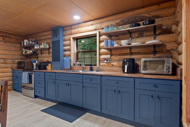 kitchen featuring log walls, light hardwood / wood-style flooring, stainless steel electric range oven, and sink