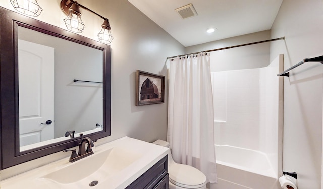 full bathroom featuring toilet, vanity, and shower / tub combo with curtain