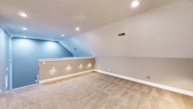 bonus room featuring lofted ceiling and carpet flooring