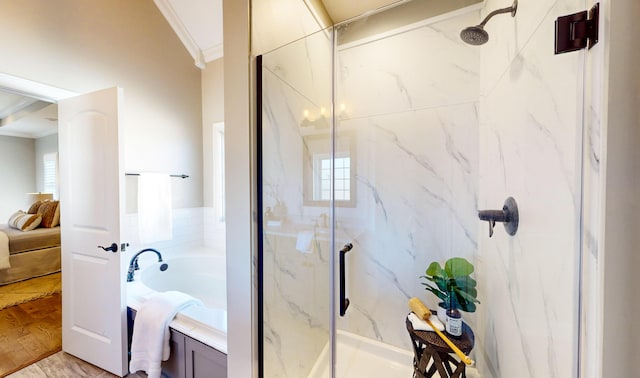 bathroom featuring wood-type flooring, crown molding, and plus walk in shower