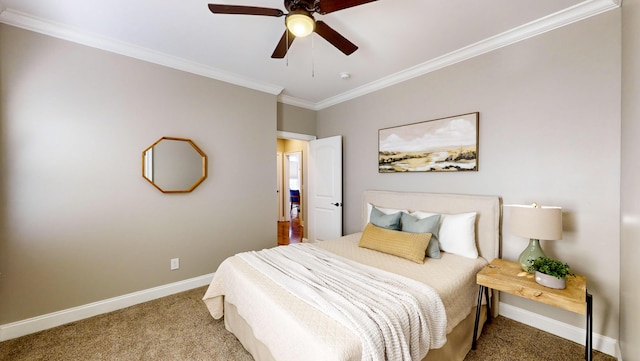 bedroom with ceiling fan, carpet floors, and ornamental molding