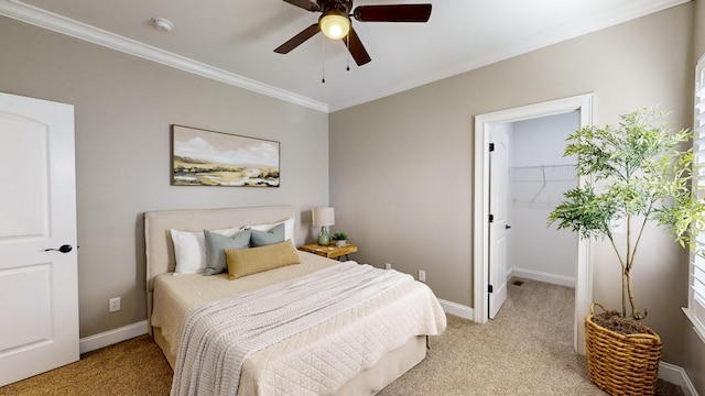 carpeted bedroom with ceiling fan and crown molding