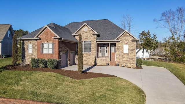 craftsman-style house with a garage and a front lawn