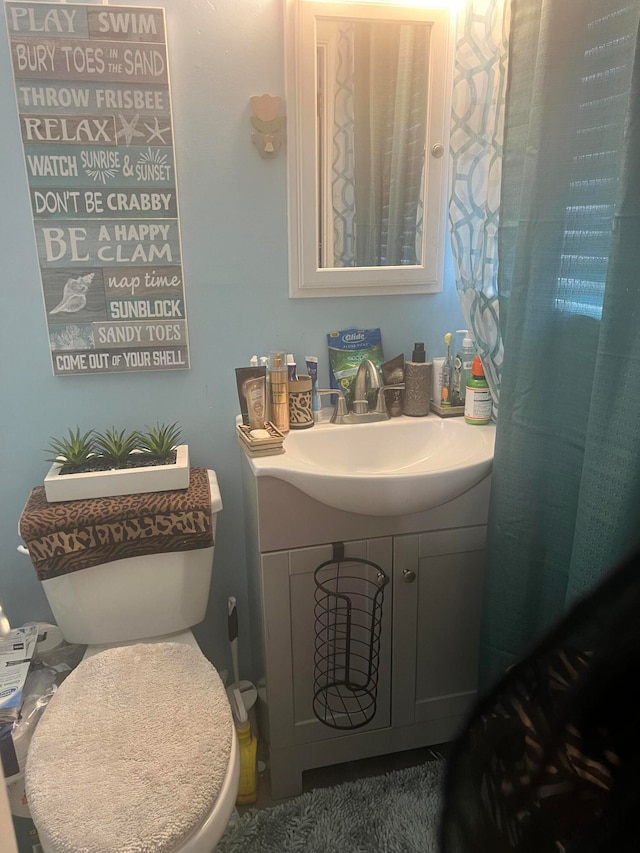 bathroom with vanity and toilet