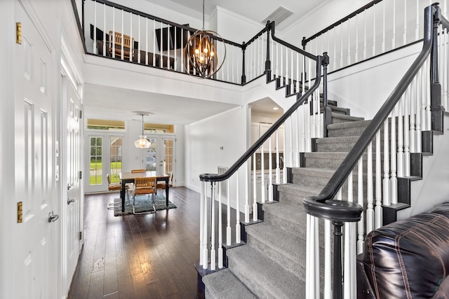 6706 Willow Trace Dr, Chattanooga, TN 37421 - stairs with french doors, a chandelier, hardwood / wood-style floors, baseboards, and crown molding